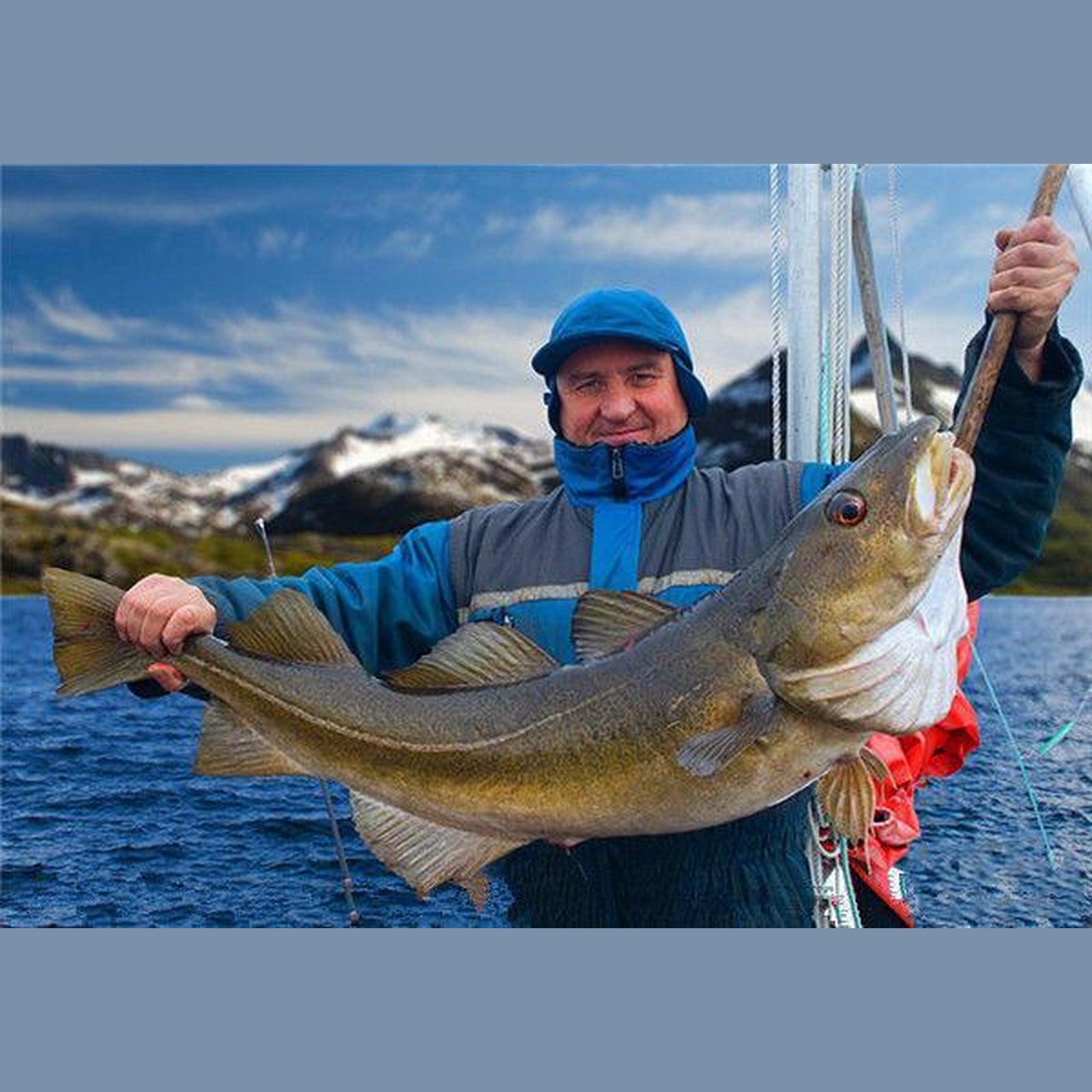Angler holding a fish caught on a topwater lure
